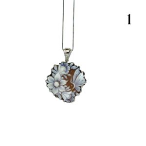 Cameo with flowers on the left and butterfly on the right