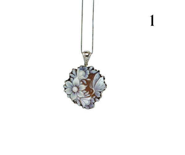 Cameo with flowers on the left and butterfly on the right